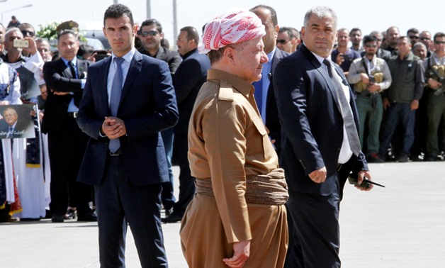 Iraqi Kurdish President Masoud Barzani walks towards the coffin of former Iraqi president Jalal Talabani at Sulaimaniya Airport, Iraq October 6, 2017. REUTERS/Ako Rasheed