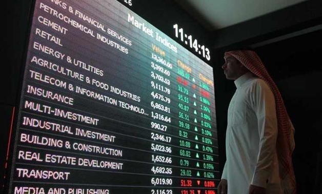 An investor monitors a screen displaying stock information at the Saudi Stock Exchange (Tadawul) in Riyadh, Saudi Arabia January 18, 2016.