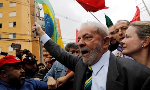 Former Brazilian President Luiz Inacio Lula da Silva arrives at Federal Justice, with senator Gleisi Hoffmann (R) for a testimony in Curitiba, Brazil, May 10, 2017. REUTERS/Nacho Doce
