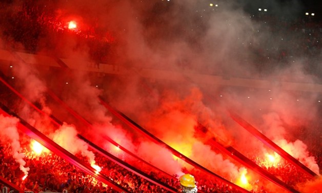 General view of fans with flares - REUTERS