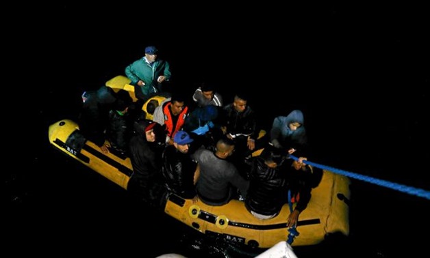 A group of Tunisian migrants arrive on a rubber boat after being rescued by the Tunisian coast guard off the coast of Bizerte - REUTERS