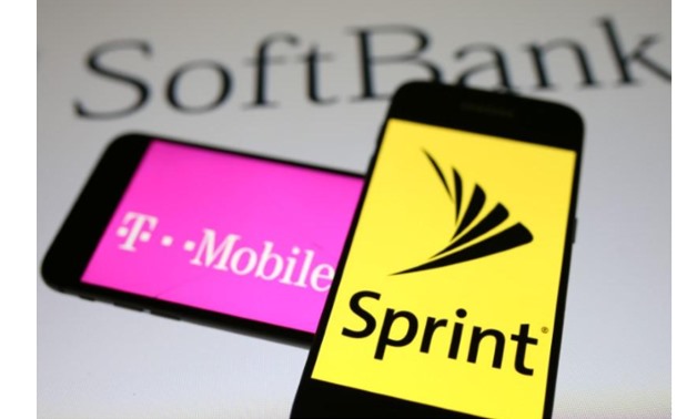 Smartphones with the logos of T-Mobile and Sprint are seen in front of a Soft Bank logo in this illustration taken September 19, 2017 - REUTERS/Dado Ruvic/Illustrations