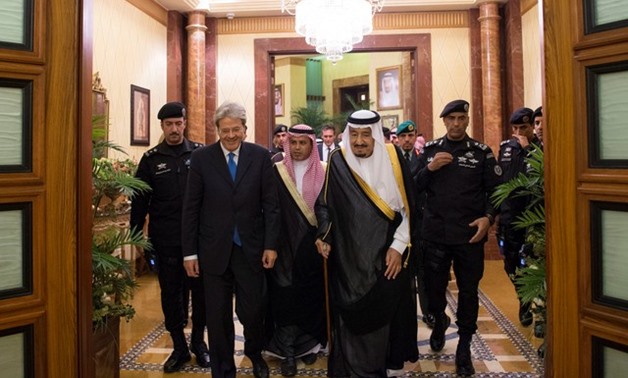 Saudi Arabia's King Salman bin Abdulaziz Al Saud walks with Italian Prime Minister Paolo Gentiloni during a reception ceremony in Riyadh - REUTERS