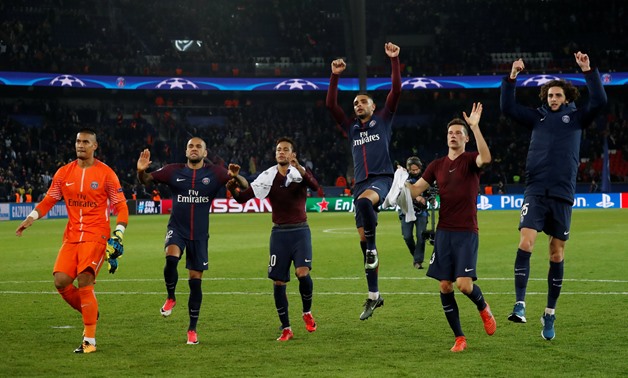 Paris Saint-Germain’s Layvin Kurzawa (3rd R) and team mates celebrate after the match REUTERS/Gonzalo Fuentes