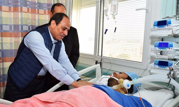 President Abdel Fatah al-Sisi visits recently freed Police Captain Mohamed al-Hayes in the hospital, after the latter was being held in terrorists' captivity.
