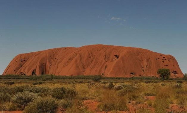 Traditional owners and National Park representatives have decided to ban the climbing of Uluru, also known as Ayers Rock, from October 2019 amid fears it was being treated as a 'theme park' - AFP