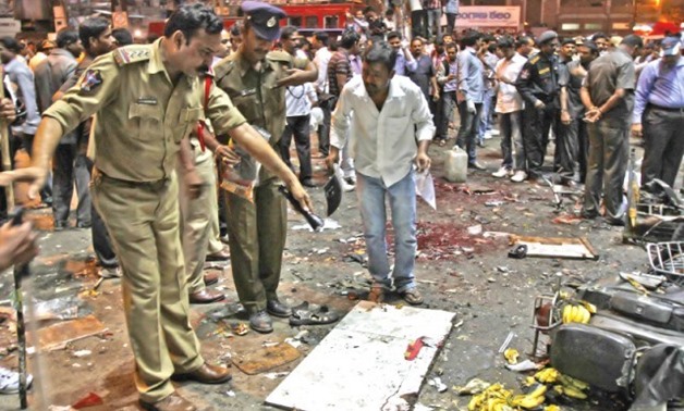 Police inspect site following a series of bomb blasts at the main railway station in Hyderabad. PHOTO: REUTERS