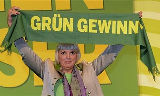 German Green Party co-leader Claudia Roth holds a scarf reading: "Green will win" after her re-election at the party convention of the Green Party in Hanover -
 REUTERS/Fabian Bimmer