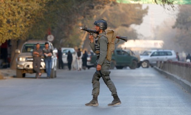 An Afghan policeman keeps watch near the site of a blast in Kabul, Afghanistan - REUTERS