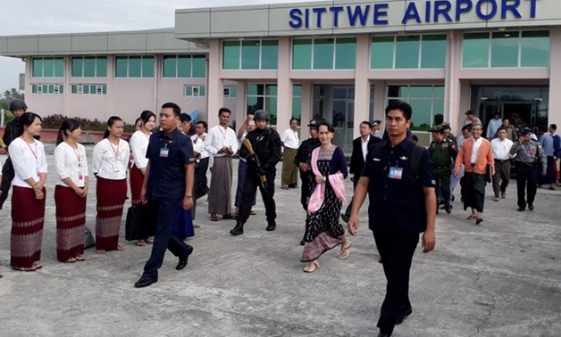 Myanmar's de facto leader Aung San Suu Kyi arrives at Sittwe airport in the state of Rakhine - REUTERS