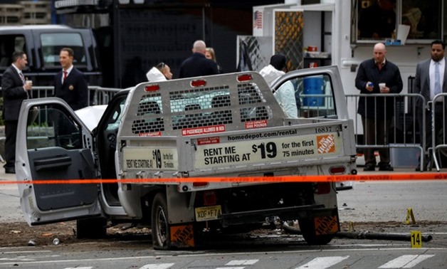 Law Enforcement officials investigate a pickup truck used in an attack on the West Side Highway in lower Manhattan in New York City, U.S., November 1, 2017. REUTERS/Brendan McDermid