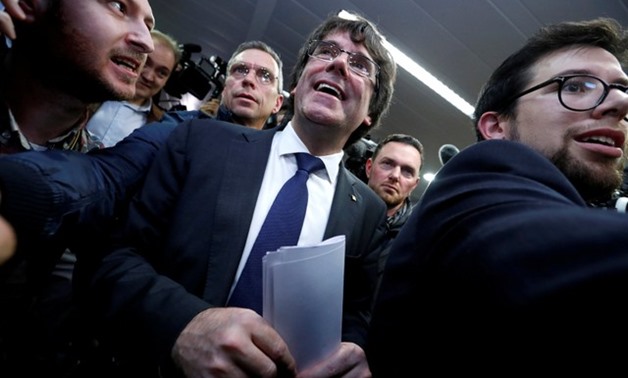 Sacked Catalan leader Carles Puigdemont departs after a news conference in Brussels - REUTERS