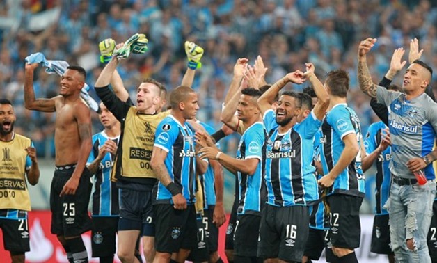 Players of Gremio celebrate after the match - REUTERS