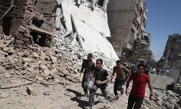 Airstrikes kill 4 in Syrian town near Damascus - Press Photo