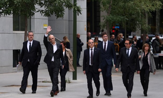 Dismissed Catalan Foreign Affairs chief Raul Romeva waves as he arrives with other dismissed cabinet members at Spain's High Court after being summoned to testify on charges of rebellion, sedition and misuse of public funds for defying the central governm
