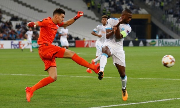 Vitoria Guimaraes' Miguel Silva clears from Marseille's Patrice Evra - REUTERS/Philippe Laurenson