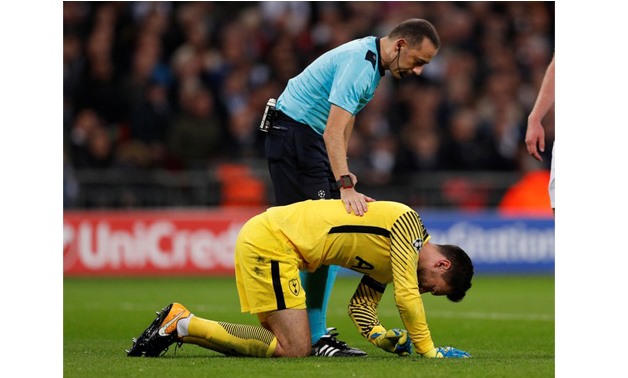 Referee Cuneyt Cakir checks on Tottenham's Hugo Lloris after sustaining an injury Action Images -
 Reuters/John Sibley