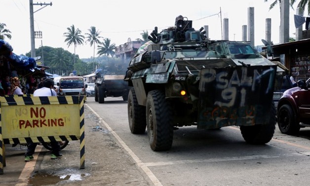Armoured Personnel Carrier (APC) drives along a highway of Saguiaran, after President Rodrigo Duterte announced the liberation of Marawi city on Monday, in Lanao Del Sur, southern Philippines, October 28, 2017 -
 REUTERS/Romeo Ranoco