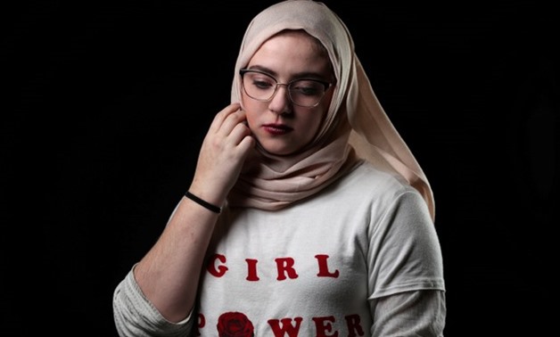 Samantha Hanahentzen, 17, poses for a #MeToo portrait in Detroit - REUTERS
