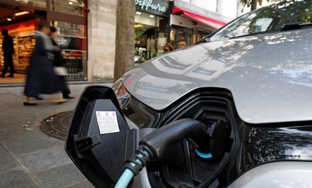 An electric car is being charged in a Paris street, France, September 12, 2017. REUTERS/Philippe Wojazer
