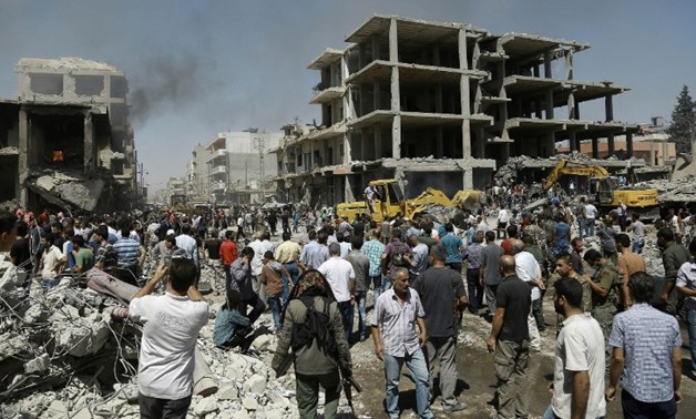 IS bombing kills dozens in east Syria - Press Photo