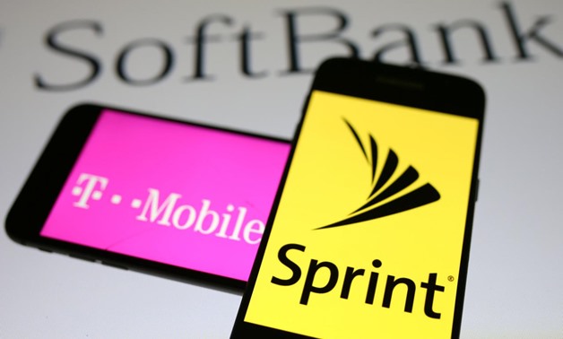 Smartphones with the logos of T-Mobile and Sprint are seen in front of a Soft Bank logo in this illustration taken -  REUTERS/Dado Ruvic/Illustrations