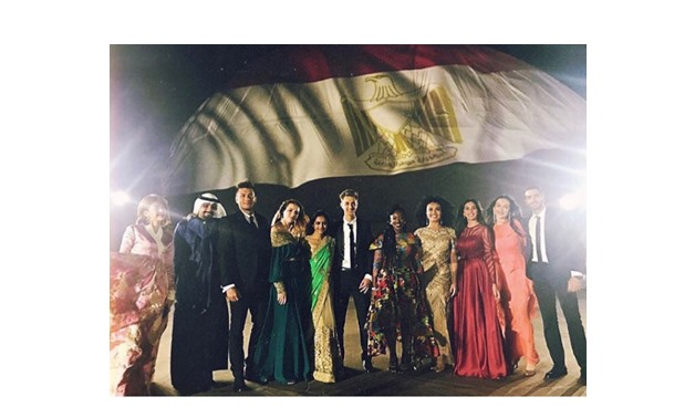 Mohamed Sharnouby along with the singers of WYF opening song - Egypt Today