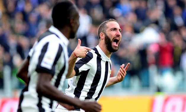 Juventus’ Gonzalo Higuain celebrates scoring their first goal REUTERS/Massimo Pinca