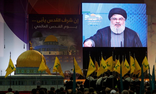 Lebanon's Hezbollah leader Sayyed Hassan Nasrallah addresses his supporters via a screen during a rally marking Al-Quds day in Beirut's southern suburbs, Lebanon June 23, 2017. REUTERS/Aziz Taher/File Photo