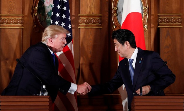 U.S. President Donald Trump and Japan's Prime Minister Shinzo Abe shake hands during a news conference at Akasaka Palace in Tokyo, Japan, November 6, 2017. REUTERS/Jonathan Ernst
