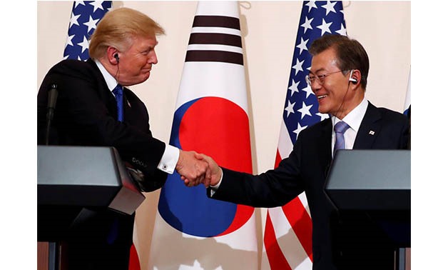 U.S. President Donald Trump and South Korea’s President Moon Jae-in shake hands during a news conference at South Korea’s presidential Blue House in Seoul, South Korea, November 7, 2017 -
 REUTERS/Jonathan Ernst