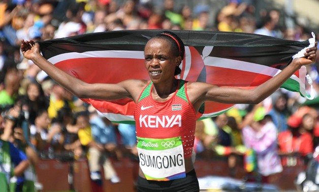 Jemima Sumgong (KEN) of Kenya celebrates after winning the 2016 Rio Olympics Women's Marathon in Rio de Janeiro - REUTERS