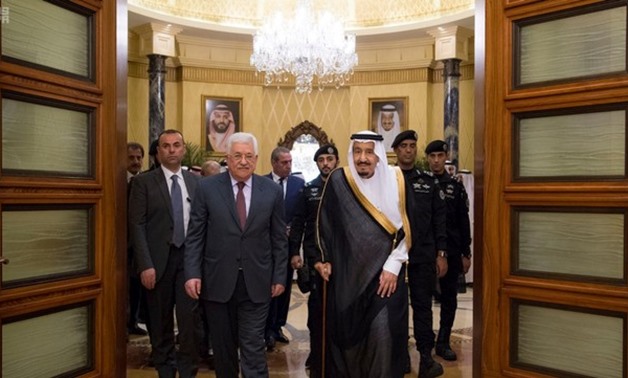 Saudi Arabia's King Salman bin Abdulaziz Al Saud walks with Palestinian President Mahmoud Abbas during a reception ceremony in Riyadh, Saudi Arabia November 7, 2017. Saudi Press Agency/Handout via REUTERS ATTENTION EDITORS