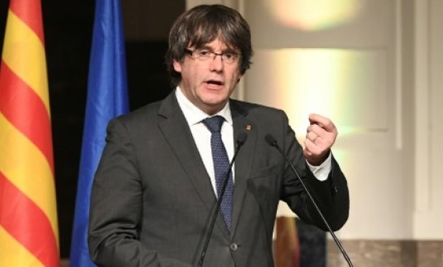 Catalonia's sacked leader Carles Puigdemont delivers a speech during a meeting with Catalan mayors in Brussels