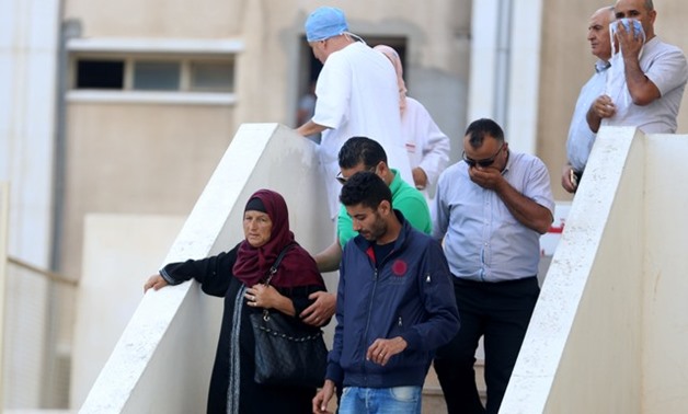 Relatives of Tunisian migrants react as they leave a hospital morgue after identifying the bodies of their families in Sfax, Tunisia October 17, 2017 - Picture taken October 17,