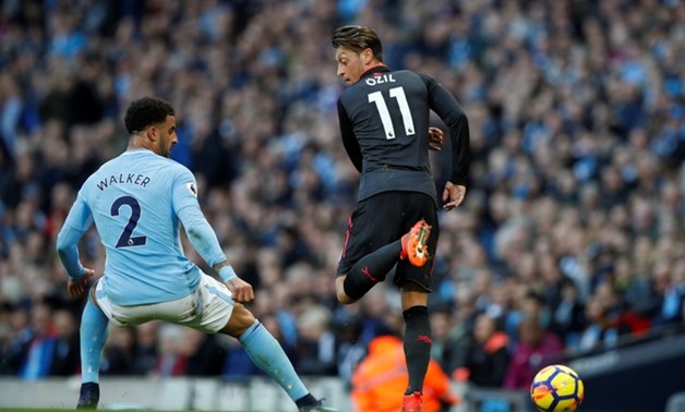 Soccer Football - Premier League - Manchester City vs Arsenal - Etihad Stadium, Manchester, Britain - November 5, 2017 Arsenal's Mesut Ozil in action with Manchester City's Kyle Walker REUTERS/Phil Noble
