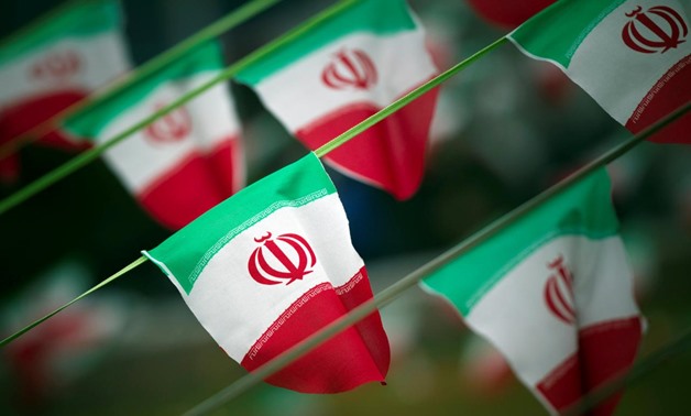 Iran's national flags are seen on a square in Tehran February 10, 2012, a day before the anniversary of the Islamic Revolution. REUTERS/Morteza Nikoubazl/File Photo

