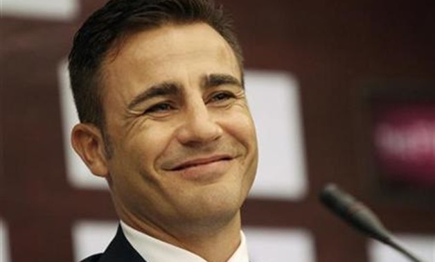 Former Italian football player and 2006 FIFA World Player of the Year Fabio Cannavaro smiles during a news conference in Phnom Penh January 9, 2012.