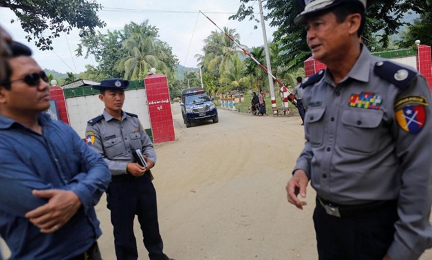 Policemen stand in front of the border guard headquarters at Kyee Kan Pyin village outside Maungdaw October 26, 2016. Picture taken October 26, 2016. REUTERS/Soe Zeya Tun