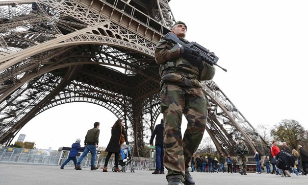 French military patrol near the Eiffel Tower the day after a series of deadly attacks in Paris- Reuters