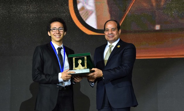 President Sisi honors Mahmoud Wael, world's smartest kid, at the World Youth forum in Sharm el Sheikh city, South Sinai- Press photo