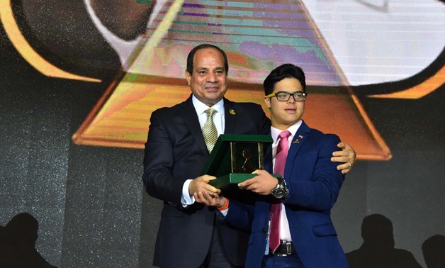 President Sisi honors swimmer Mohamed Al-Husseini, first Egyptian swimmer with Down Syndrome, who tried to cross the English channel - Press photo