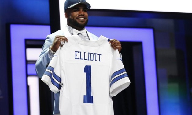 Ezekiel Elliott (Ohio State) after being selected by the Dallas Cowboys as the number four overall pick in the first round of the 2016 NFL Draft at Auditorium Theatre. Mandatory Credit: Kamil Krzaczynski-USA TODAY Sports / Reuters