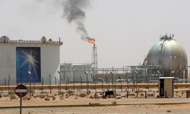 A gas flame is seen in the desert near the Khurais oilfield, about 160 km (99 miles) from Riyadh, Saudi Arabia June 23, 2008. REUTERS/Ali Jarekji/File Photo
