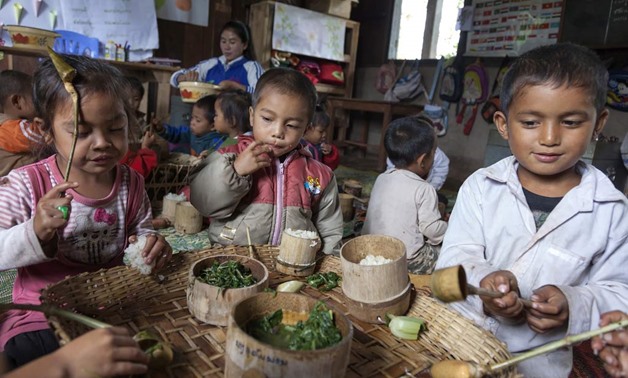 Laos: nutritious meals are bringing more children to school. Photo: World Bank/Bart Verweij
