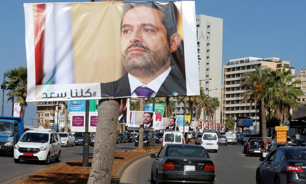 FILE PHOTO: Posters depicting Lebanon's Prime Minister Saad al-Hariri, who has resigned from his post, are seen in Beirut, Lebanon, November 10, 2017. REUTERS/Mohamed Azakir
