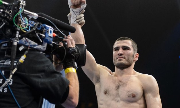 Russian boxer Artur Beterbiev (pictured) claimed his first world title belt with a 12th round knockout of Enrico Koelling in a battle for the vacant IBF light heavyweight crown - AFP Photo/Minas Panagiotakis