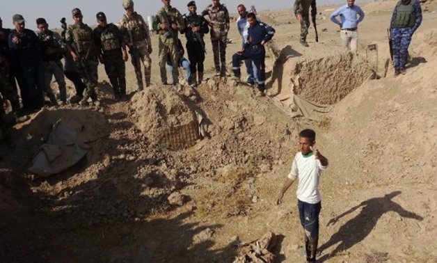 Mass graves containing at least 400 suspected Islamic State group - AFP