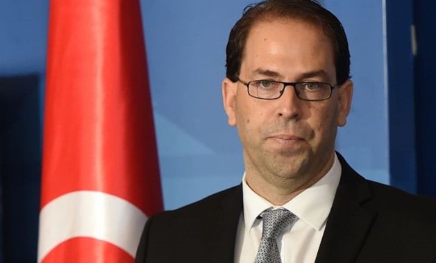 Tunisia's newly appointed prime minister-delegate Youssef Chahed speaks to the press after being appointed - AFP
