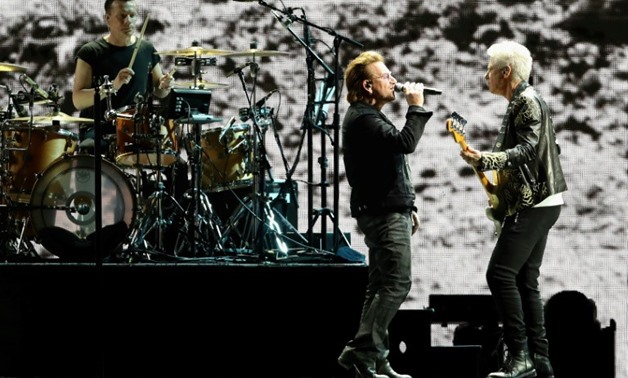 Larry Mullen Jr, Bono and Adam Clayton of U2 performing at the University of Phoenix Stadium in Arizona in September. 
